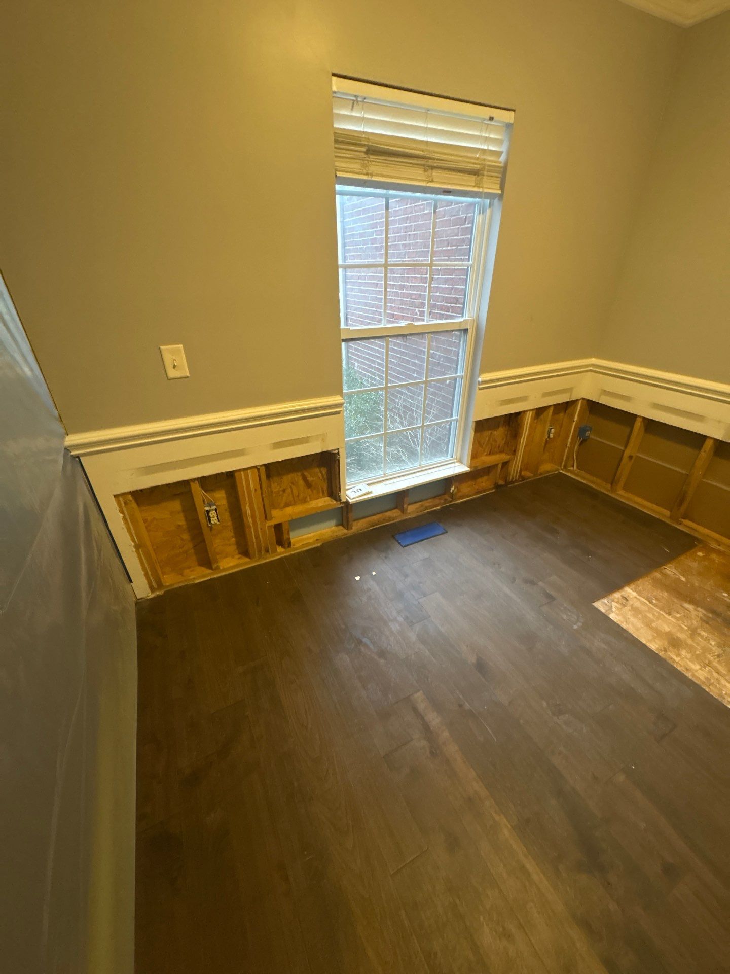 Water Damage Demo — Drywall removed to expose framing for inspection.